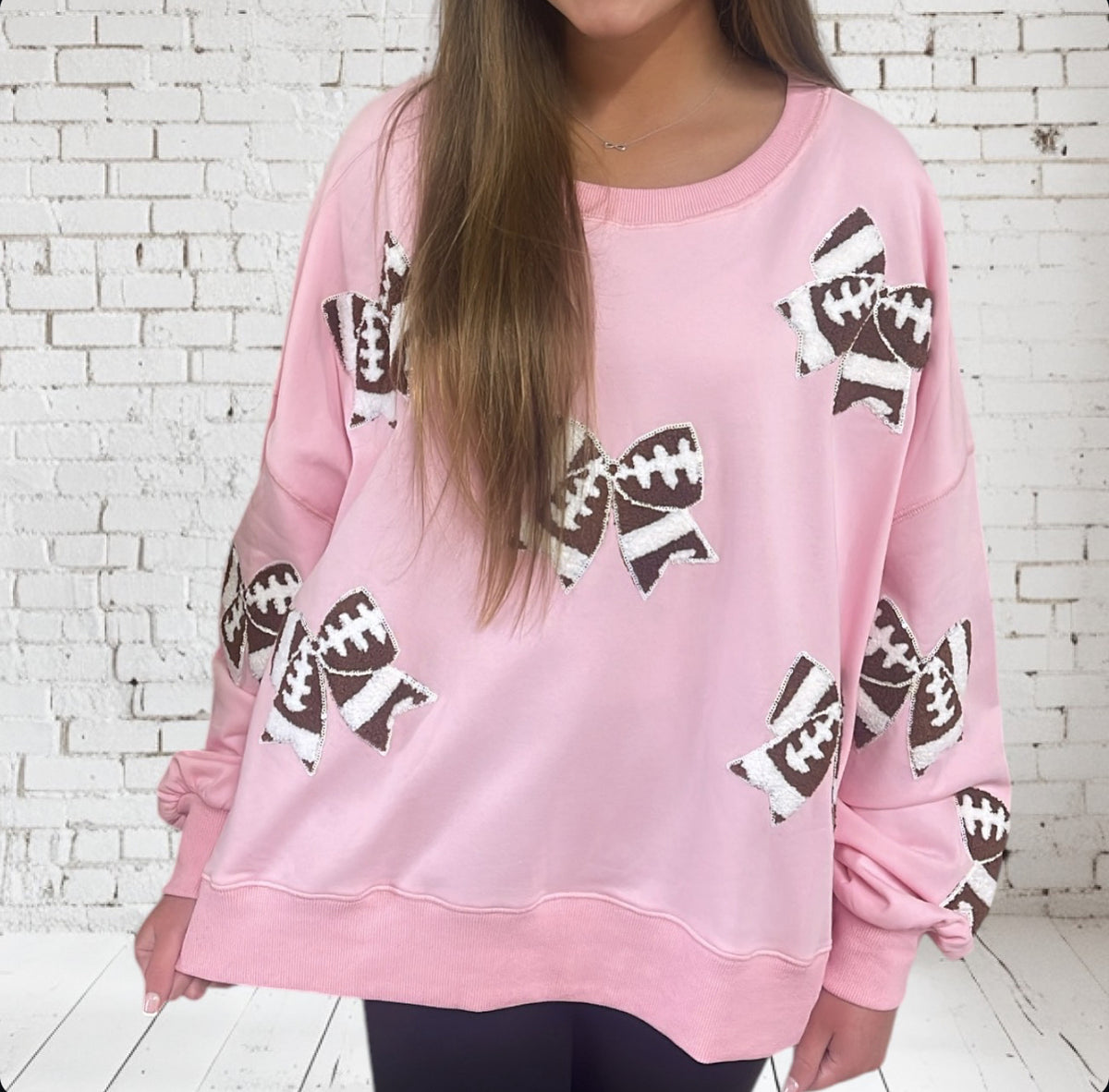 PINK FOOTBALL BOWS SWEATSHIRT