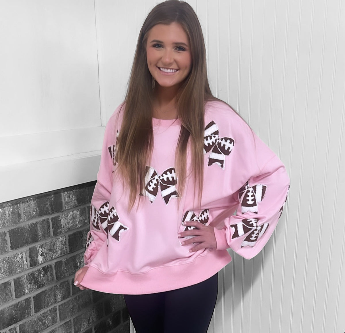 PINK FOOTBALL BOWS SWEATSHIRT
